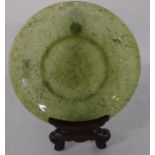 Chinese carved spinach jade plate diameter 19cm with mahogany stand