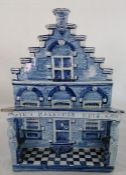 Delft tin glazed model of a house, painted in blue titled to the top IN't MAKKUMER HUIS  some