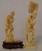 2 Meiji period ivory okimono of a man standing on a rock mounted on a wooden base Ht 17.5cm & a