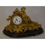 French gilded figural clock depicting a boy with rifle & a brace of partridge on an ebonised base.