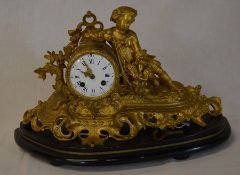 French gilded figural clock depicting a boy with rifle & a brace of partridge on an ebonised base.