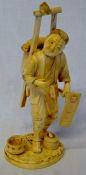 Meiji period ivory okimono farmer with knapsack with small bird perched on top Ht 24cm