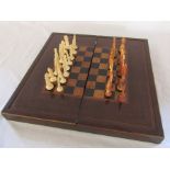 Late 19th century folding chess & backgammon board with Oriental chess pieces