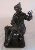 Bronze figure of a jester stood next to three gold balls H 28 cm