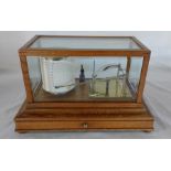 Manoah Rhodes & Sons Ltd Bradford oak cased hygrograph with bevelled glass panels and chart drawer