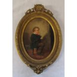 Gilt framed oval oil on board of a young boy eating fruit by Edward Charles Barnes signed Barnes