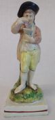 19th century Staffordshire Ralph Wood type pearlware figure emblematic of Autumn, holding grapes and