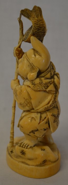 Meiji period carved ivory okimono depicting a fisherman with carp above his head Ht 13cm - Image 3 of 5