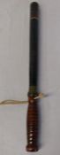 Ebonised truncheon marked with crown GR5, 51cm in length with a shaped handle