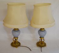 Pair of gilded dolphin & glass table lamps (some repair)