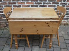 Pine table with a drop leaf and two chairs