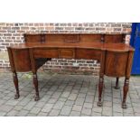 A fine Regency mahogany sideboard with ebony stringing & reeded columns on paw feet with bow fronted