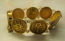 Oriental style gold bracelet marked 14K weight 22.1 g