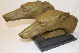 A large resin model of two Greyhounds signed M Bertin on marble base (damage to one ear)
