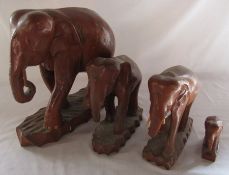 4 large wooden elephants (tusks af) H 38, 25, 23 and 10 cm