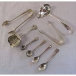 Assorted silver sugar tongs, salt / mustard spoons and sugar spoons total weight 3.38 ozt