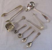 Assorted silver sugar tongs, salt / mustard spoons and sugar spoons total weight 3.38 ozt