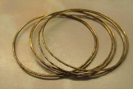 6 gold bangles marked 14K weight 11.9 g