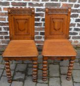 Pair of late Victorian oak hall chairs (some repair)