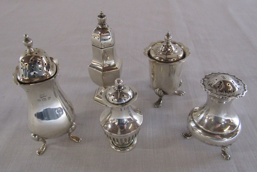 5 silver pepper pots - Birmingham 1897, 1905, 1929, 1940 and Sheffield 1914 total weight 5.88 ozt