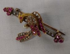 Tested as 14ct gold bird bar brooch set with old cut diamonds and rubies total weight 8.6 g size