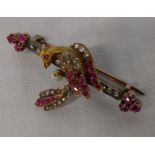 Tested as 14ct gold bird bar brooch set with old cut diamonds and rubies total weight 8.6 g size