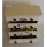Small cabinet containing costume jewellery