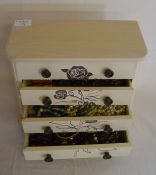 Small cabinet containing costume jewellery