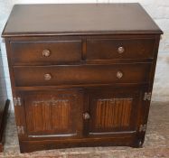 Small Priory style oak chest of drawers with linen fold panels