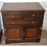 Small Priory style oak chest of drawers with linen fold panels