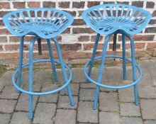 Pair of metal tractor seat style bar stools