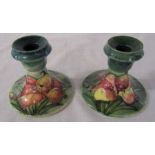 Pair of Moorcroft orchid pattern candlesticks H 9 cm