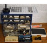 Small cabinet containing watch parts & spares, Moore & Wright gauge, watch straps etc