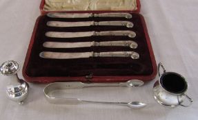 Cased set of silver handle knives (1 missing), silver sugar tongs London 1879 weight 1.65 ozt,