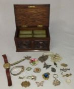 Carved oak box containing selection of costume jewellery, 22ct gold wedding ring, silver bar brooch,