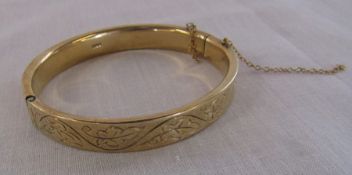 9ct gold bangle 7 cm x 6.5 cm weight 28.2 g