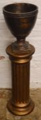 Bronze effect torchere in the shape of a classical column & a jardiniere