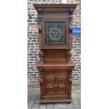 Early 20th century heavily carved oak cabinet with stained glass panel H 226 cm D 48 cm L 90 cm