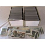 2 boxes containing approximately 1000 postcards relating to the United States including some from