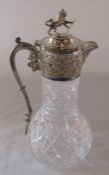 Cut glass and silver plate claret jug with mask head spout and lion and shield finial