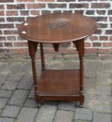 Early 20th century oak circular occasional table with carved top