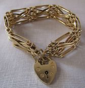 9ct gold bar bracelet with 9ct gold heart shaped lock weight 26.1 g