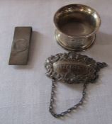 Silver whisky label Birmingham 1973, napkin ring Sheffield 1943 and money clip Birmingham 1982 total