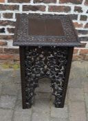 Ornately carved lamp table with pierced fretwork side panels