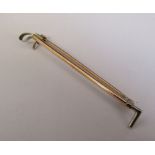 Tested as 9ct gold riding crop brooch weight 2.3 g