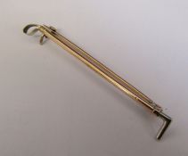 Tested as 9ct gold riding crop brooch weight 2.3 g