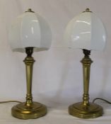 Pair of brass table lamps with opaque glass shades