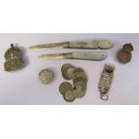 2 mother of pearl and silver fruit knives, silver three pence pieces, whistle and assorted badges