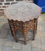 Eastern inlaid octagonal table on a folding base & inlaid with mahogany & ivory