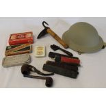 Selection of cut throat razors, 1954 army helmet, pig scraper, American spanner etc.